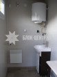 Общественный туалет с кабинкой кассира 