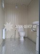 Общественный туалет с кабинкой кассира 